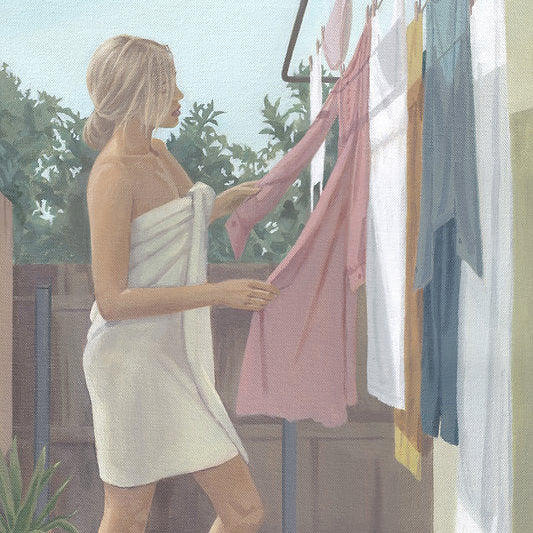 Woman hanging clothes on a line outdoors