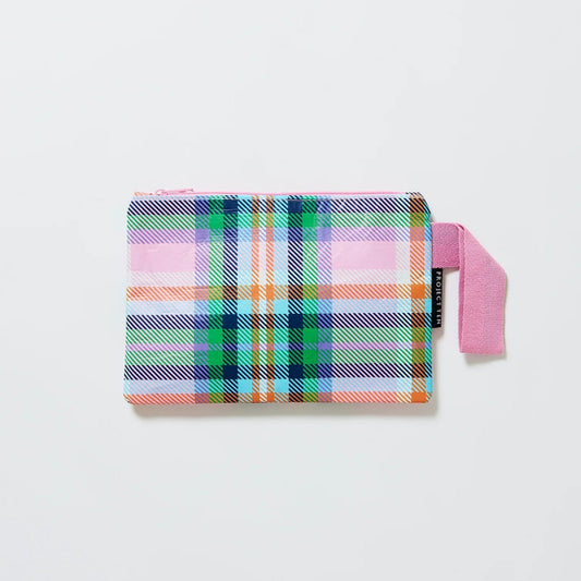 The image shows the mini plaid pouch by Project ten. The mini zip pouch has a pink zip and a pink cotton handle. The colours of the pouch are pink, blue, purple, green and orange. 