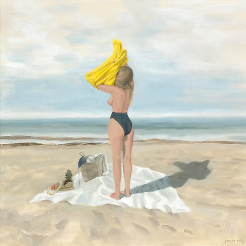 Woman in a swimsuit with a yellow towel on her head at the beach