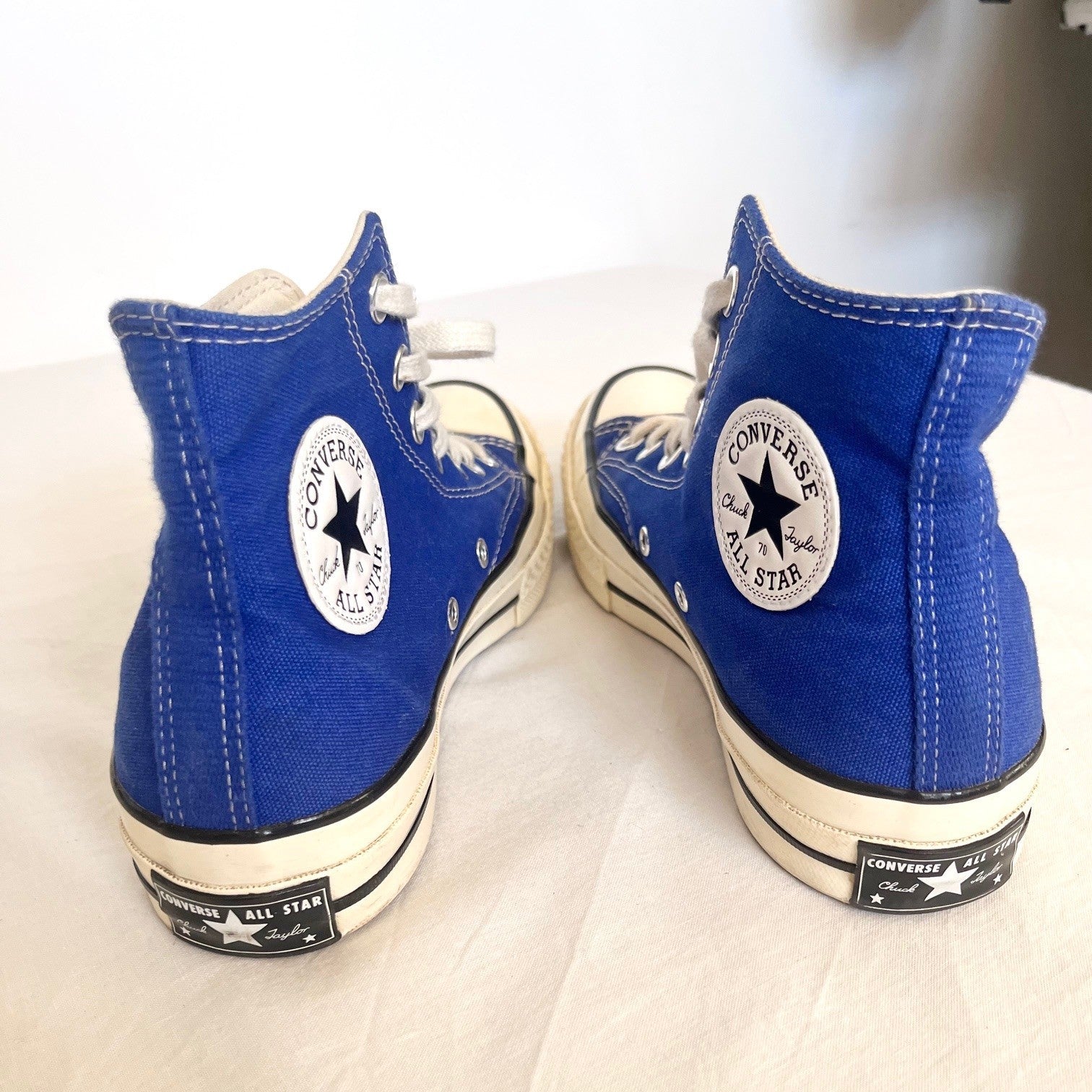 Pair of blue Converse All Star high-top sneakers on a white background
