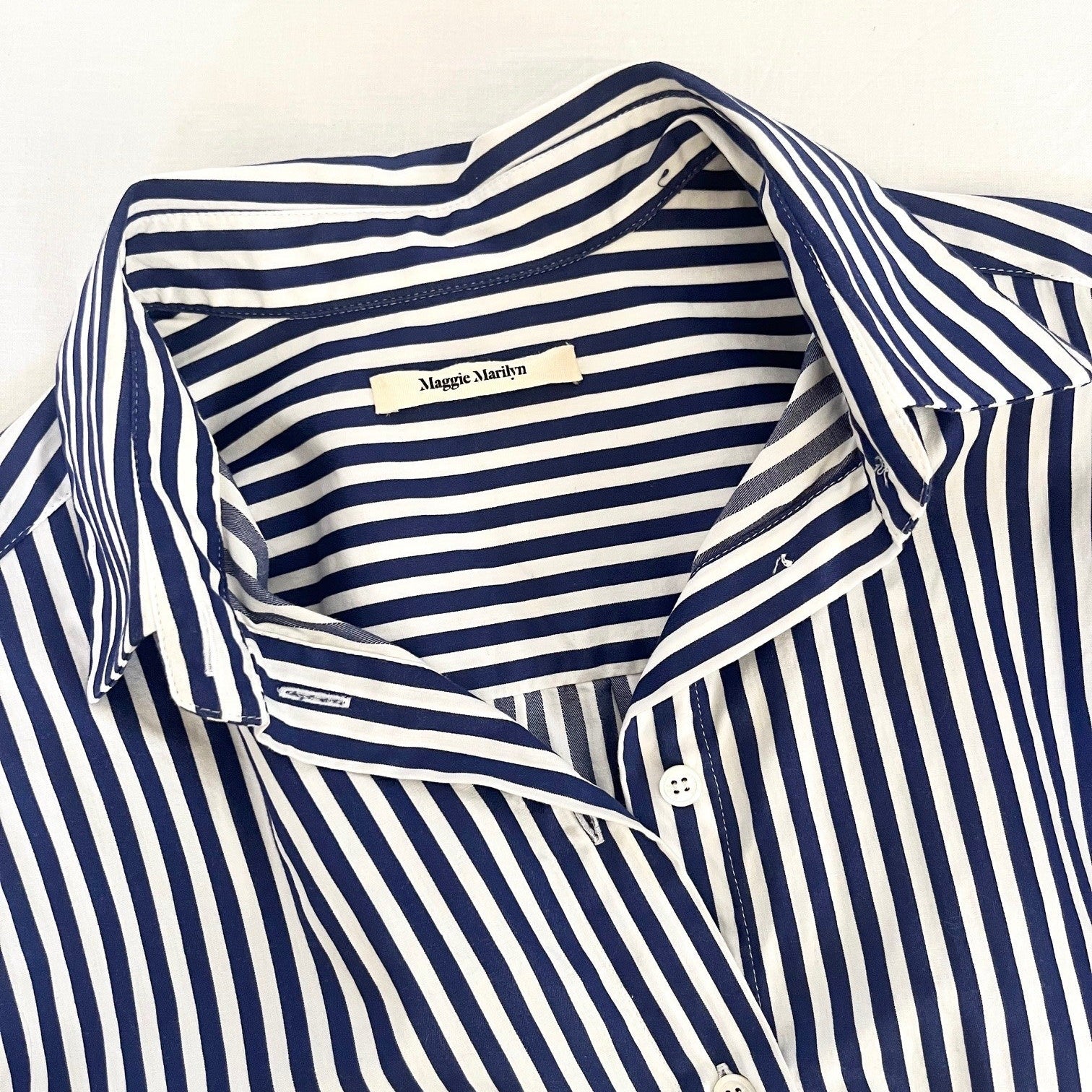 Navy and white striped shirt with "Maggie Marilyn" label on a white background