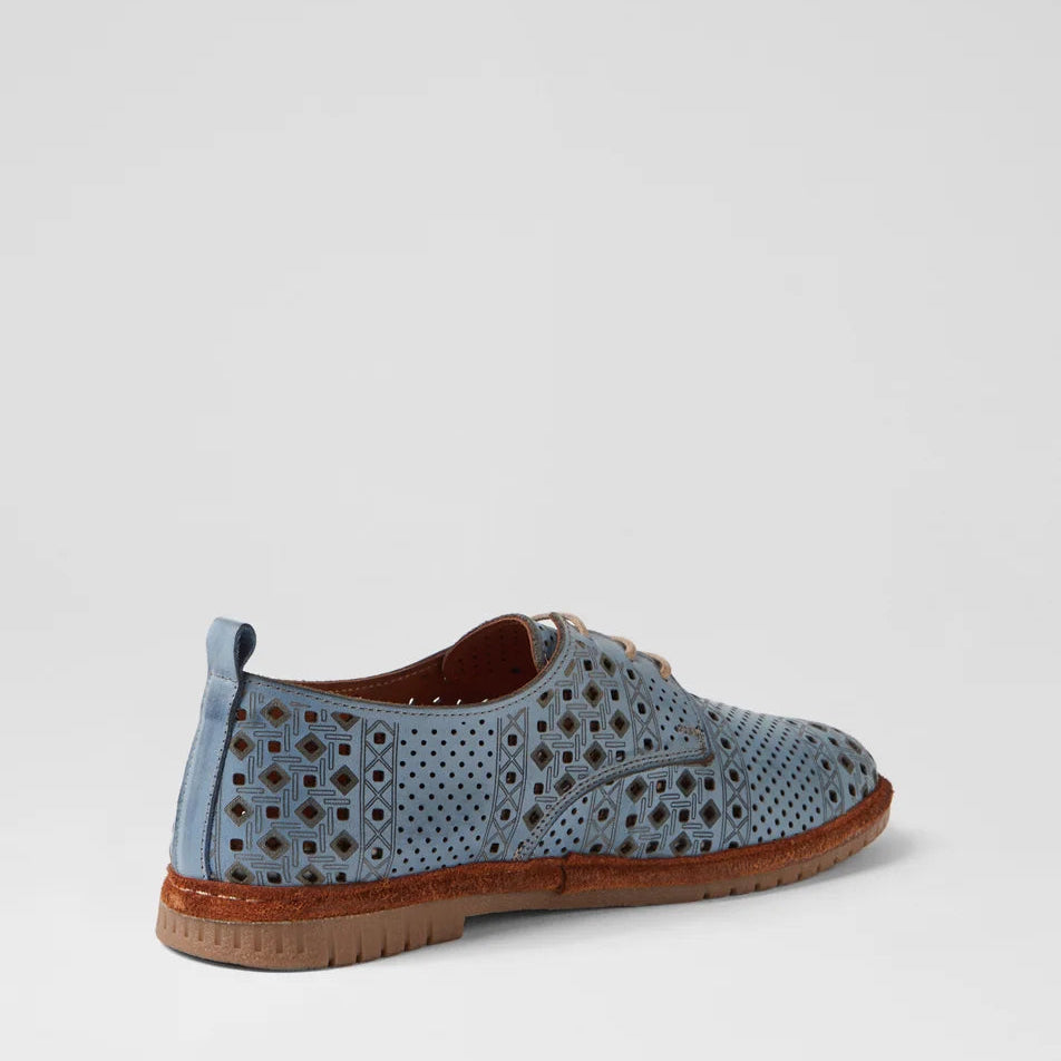 Blue perforated shoe with brown sole on a light gray background